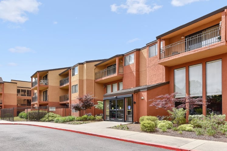 A stucco condo building