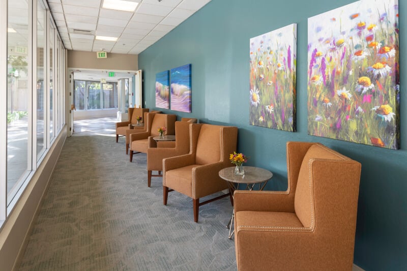 hallway with art and chairs