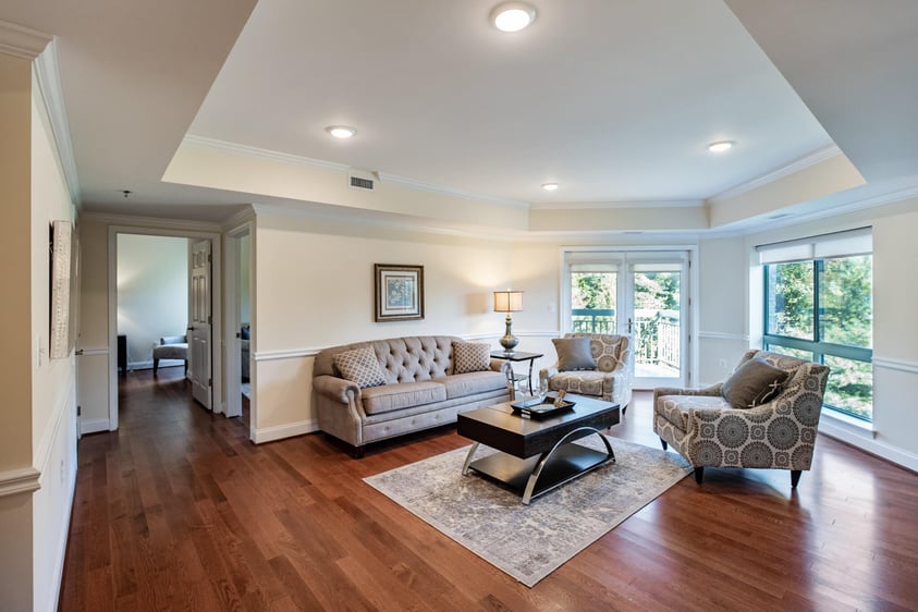 Living room of an apartmentWhite kitchen with stainless steel appliances in an apartment at Rydal Park & Waters