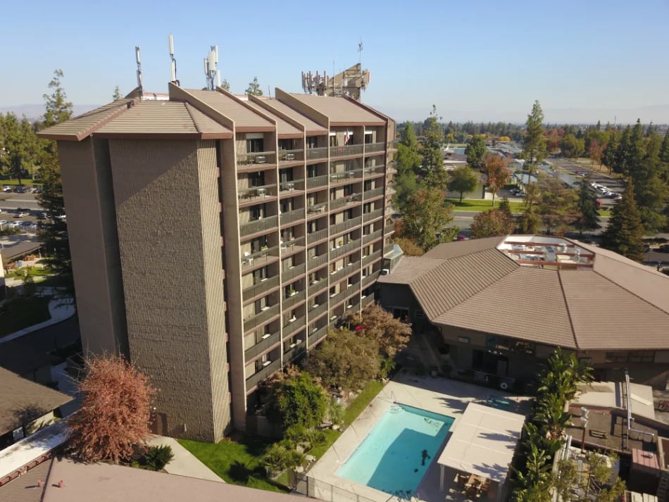 Overhead shot of building with pool at rear