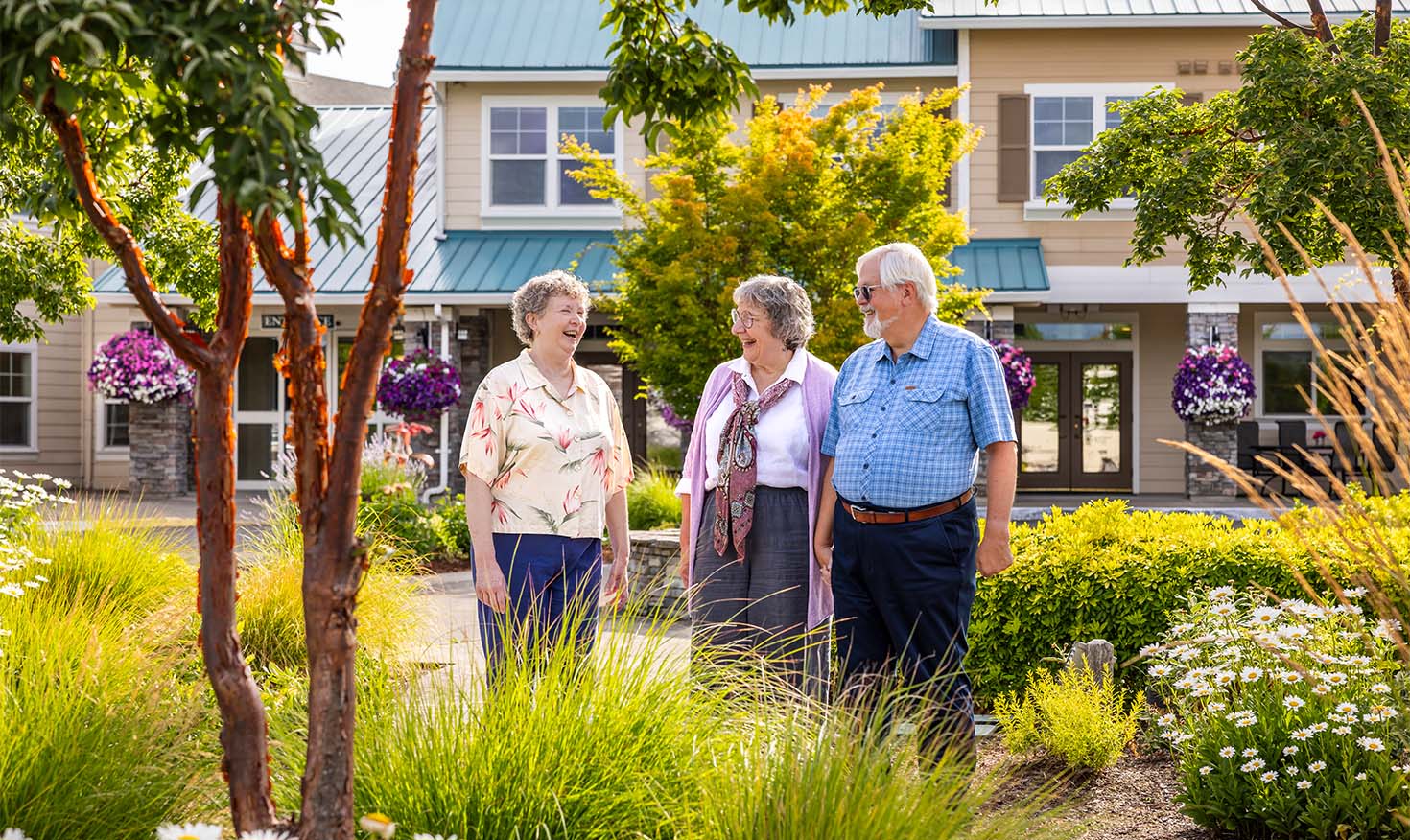 Two senior women and one senior man enjoying the outdoors in a small downtown community