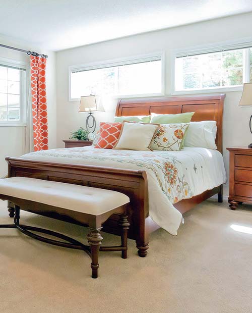 Bedroom furniture in a room with natural light