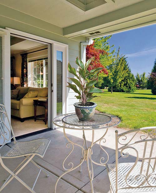 Covered outdoor patio with bistro table
