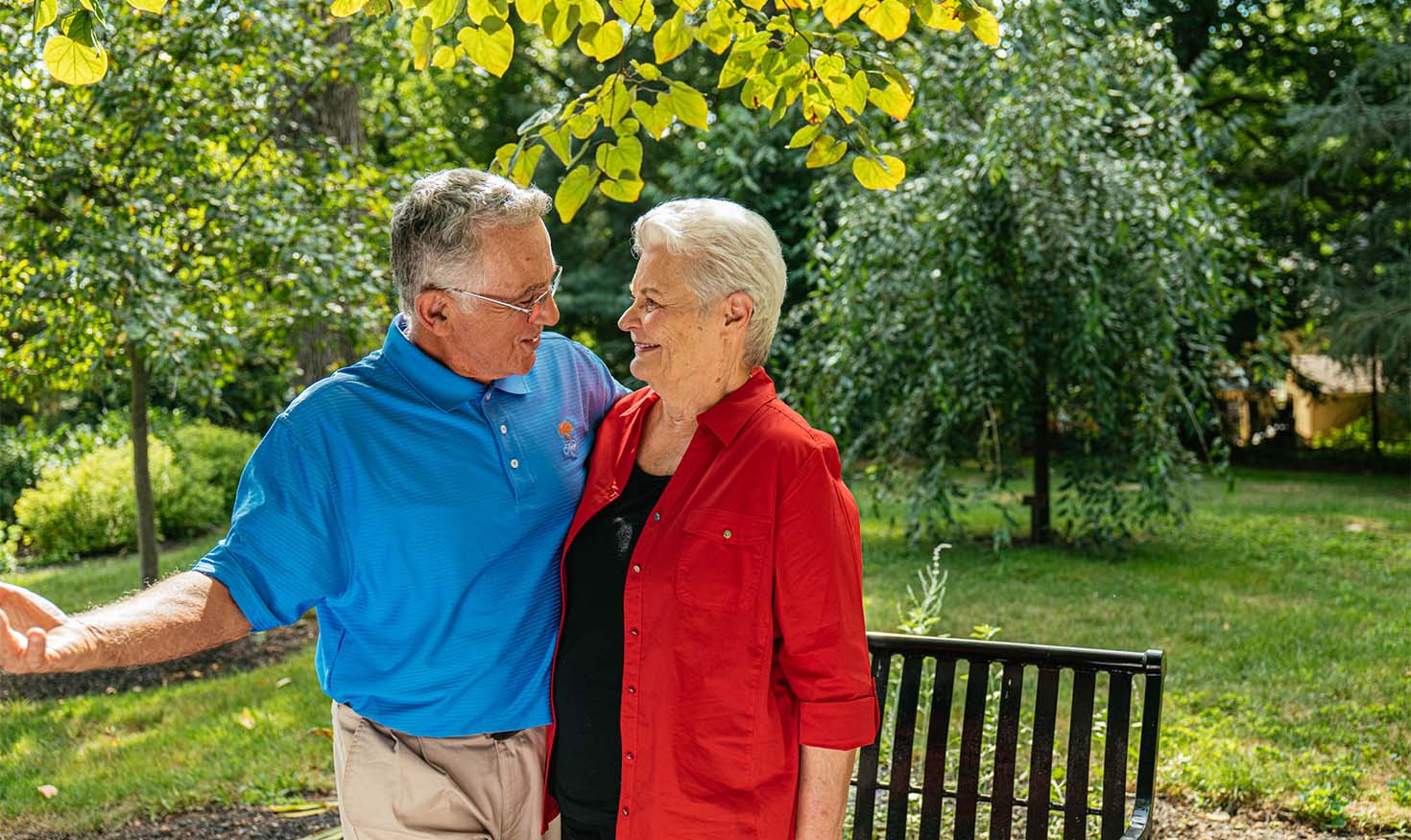 Senior couple smiling outside