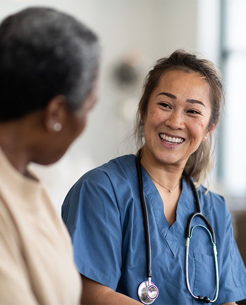 Nurse smiling at senior woman