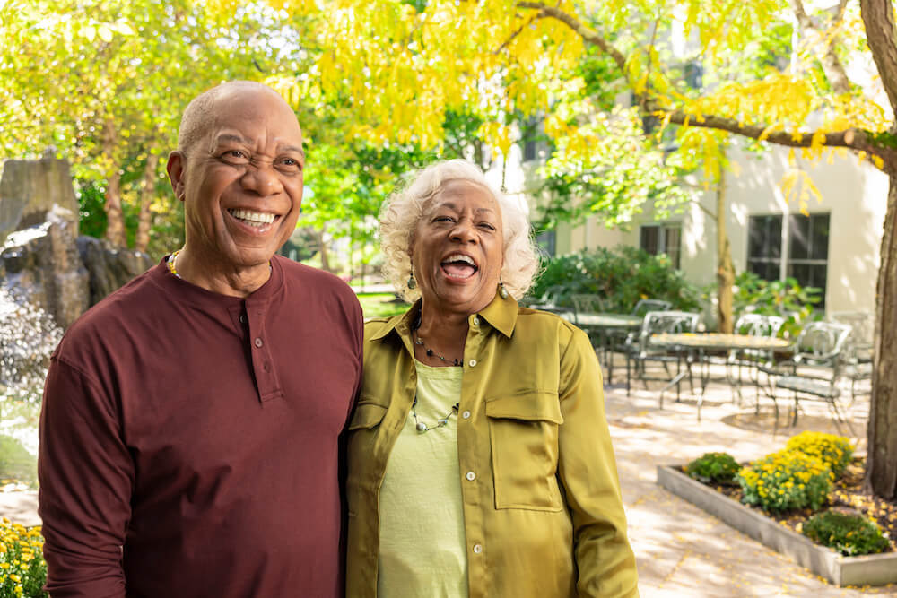Senior couple smiling on patio