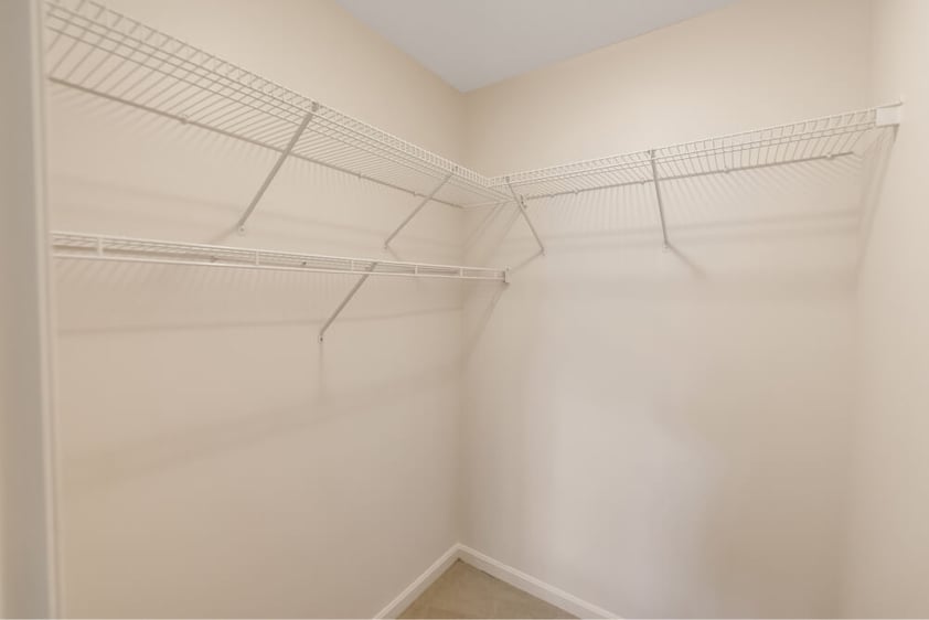 Walk-in closet of of an independent living apartment at Springhouse