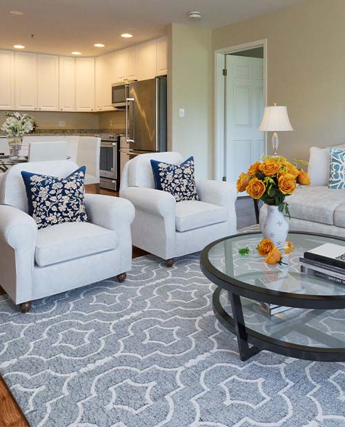 Living room and kitchen of an independent living apartment at Springhouse
