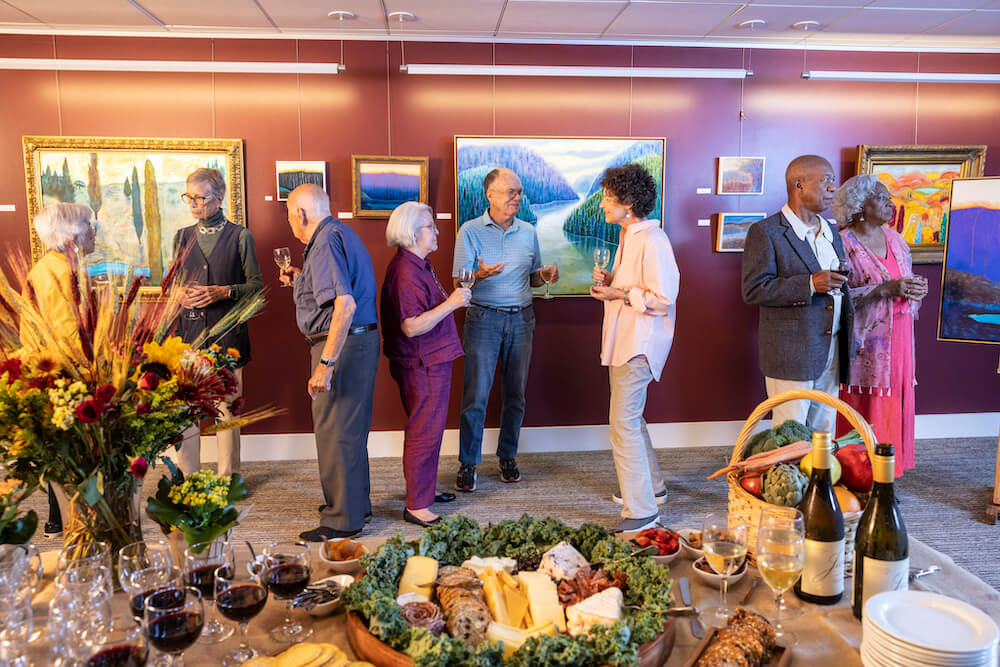 Group of seniors at a reception at an art gallery
