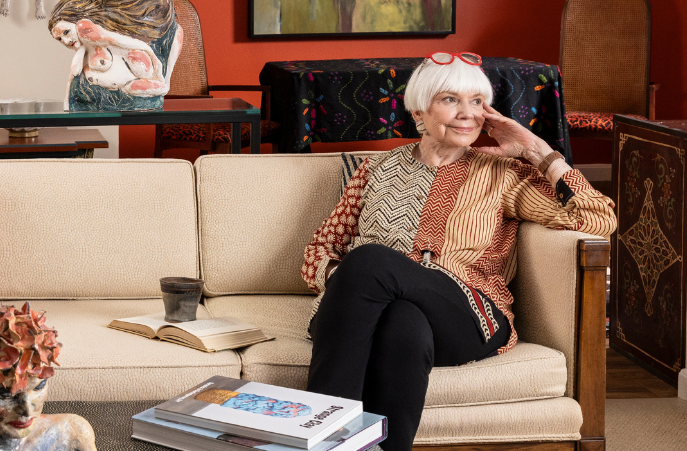  Senior woman sitting on a couch in living room