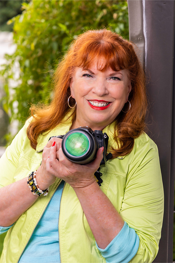 Senior woman holding a digital camera