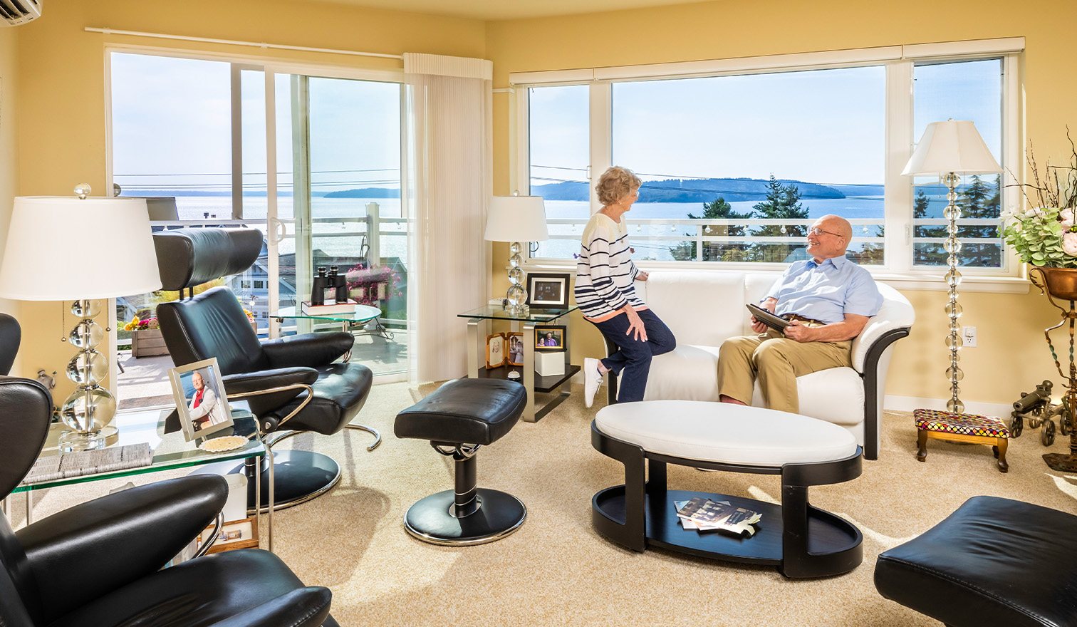 Senior couple inside their Judson Park apartment that overlooks the Puget Sound