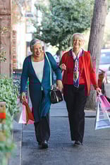 seniors walking through town shopping