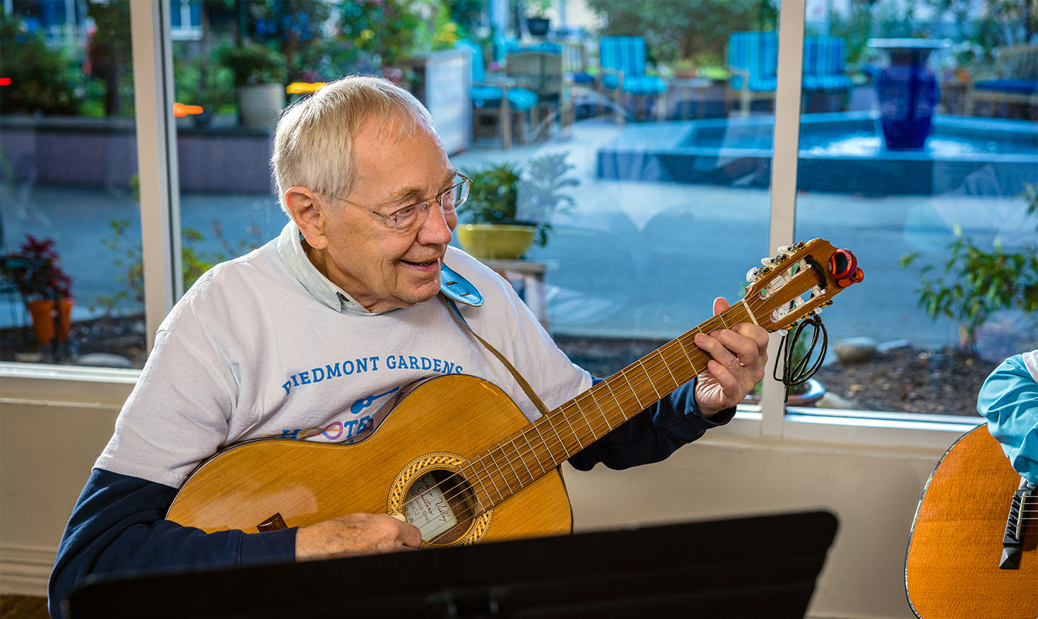 Senior man playing guitar