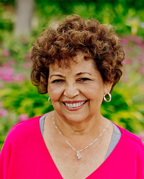 senior smiling outside