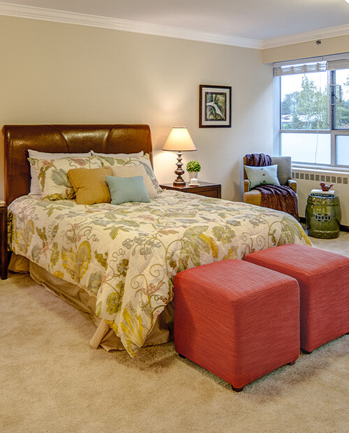 Bedroom of an apartment at Rosewood, a HumanGood Life Plan Community