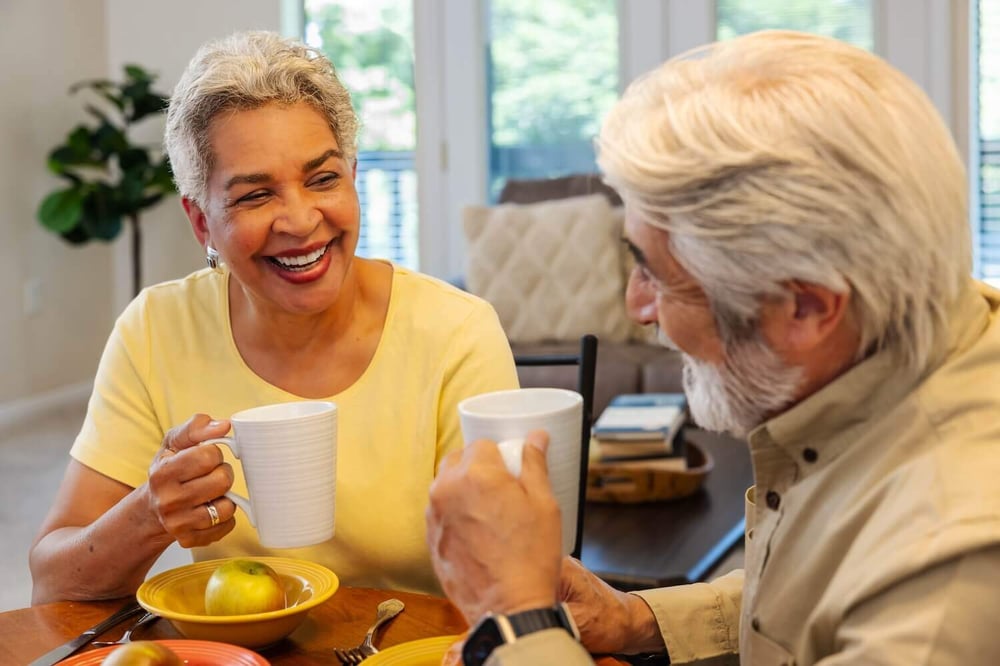 Smiling couple having coffee