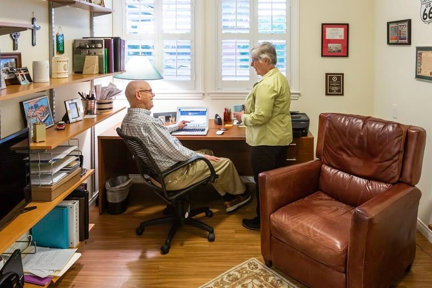 Senior couple in the office of their apartment at Royal Oaks