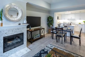 View of the dining area and kitchen from the living room of an apartment at Royal Oaks