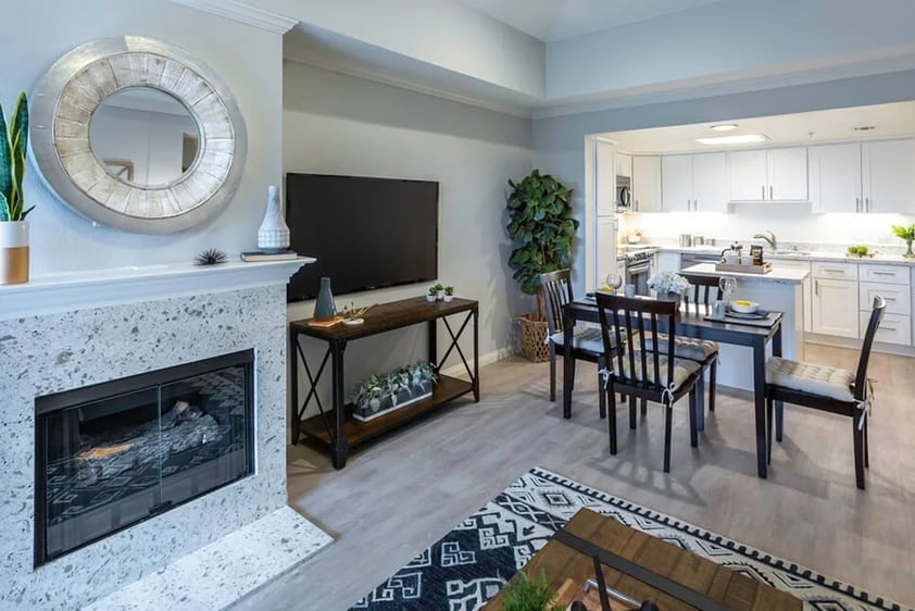 View of the dining area and kitchen from the living room of an apartment at Royal Oaks