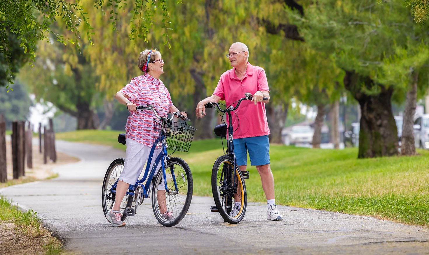 Senior couple on bikes on a trail at Royal Oaks