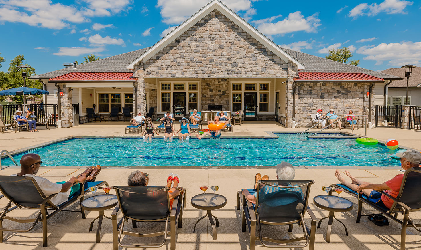 Groups of seniors enjoying a day at the community pool