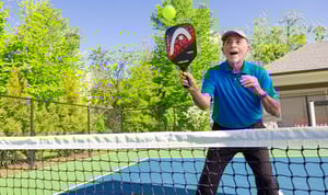 Senior man playing pickleball