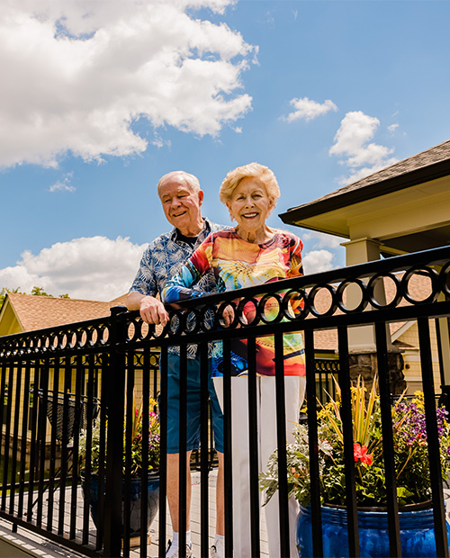 Senior couple on the balcony of their home