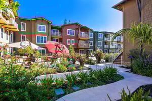 Exterior of apartment buildings featuring landscaped grounds at The Terraces at Los Altos