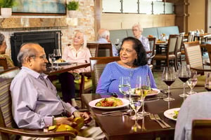 Seniors eating dinner in The Terraces of Los Altos fine dining venue