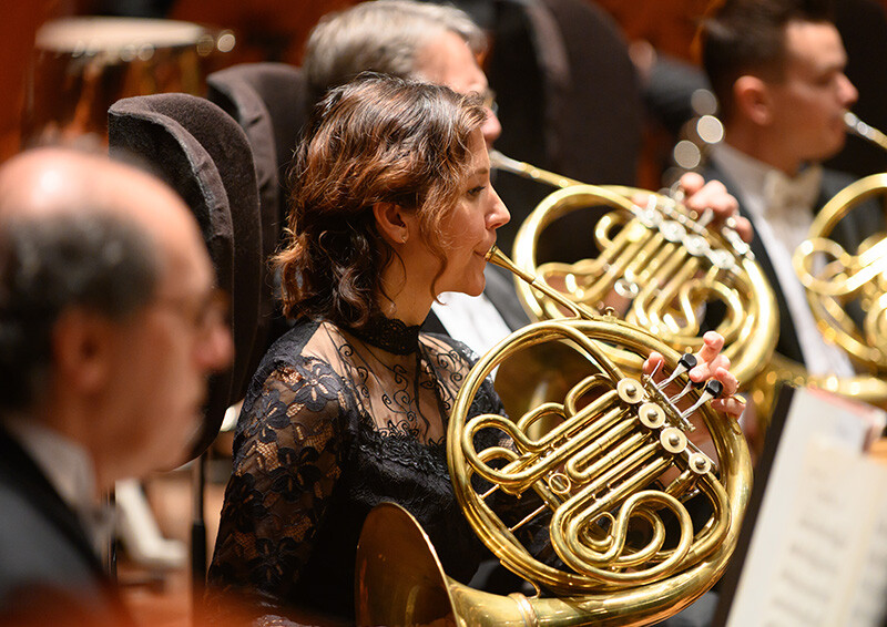 A member of the San Francisco Symphony playing the French horn
