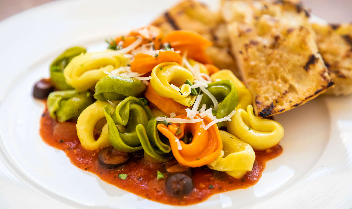 Tortellini pasta dish on a white plate