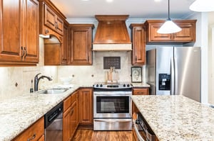 Close-up view of island and kitchen area in cottage home.