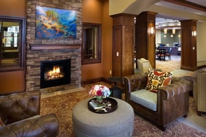 Large, warm seating area with a fireplace at The Terraces of Boise