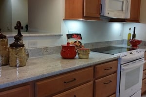 Containers on granite countertops in a kitchen of an apartment at The Terraces of Boise