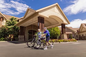 Senior couple with bicycles outside The Terraces of Boise