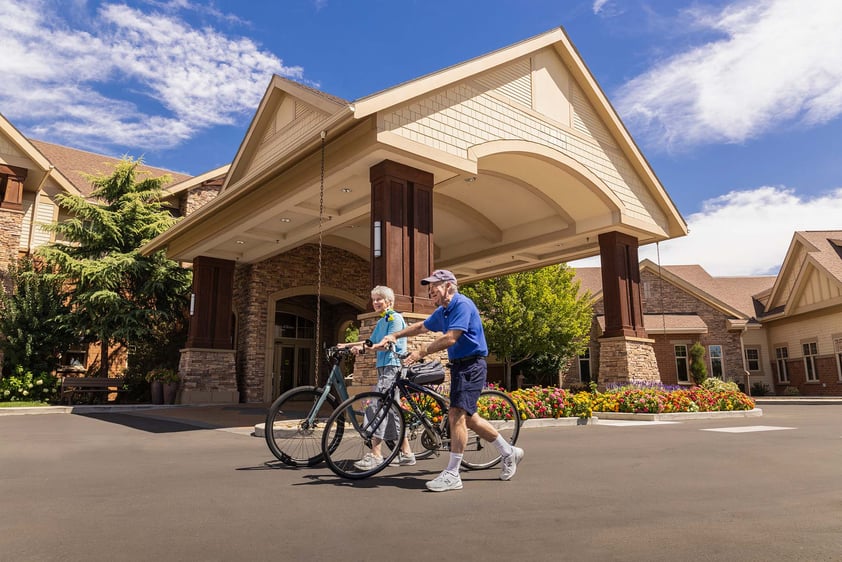 Senior couple with bicycles outside The Terraces of Boise