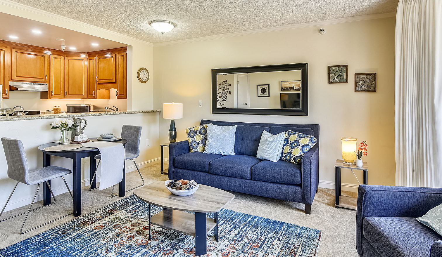 Large living area with blue couch