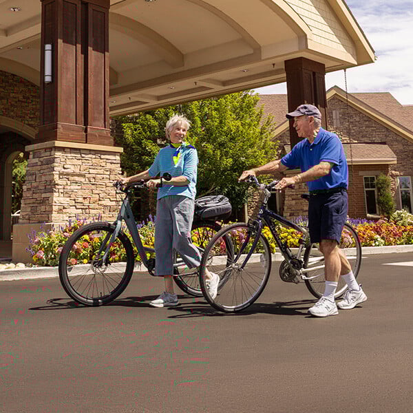Senior couple with bicycles outside The Terraces of Boise