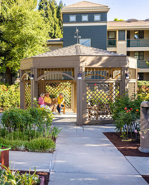 Seniors sitting in a gazebo at The Terraces of Los Gatos