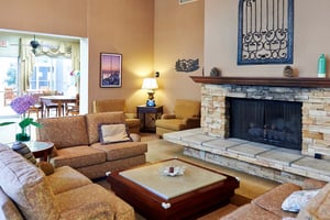 Living area with large couches and a fireplace