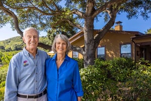 Senior couple outside their home at Valle Verde