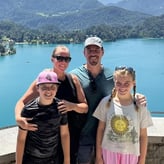 Andy McDonald posing in a photo with his family