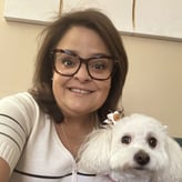 Jessica Morales smiling with her dog