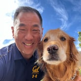 Phil Chuang with his golden retriever dog