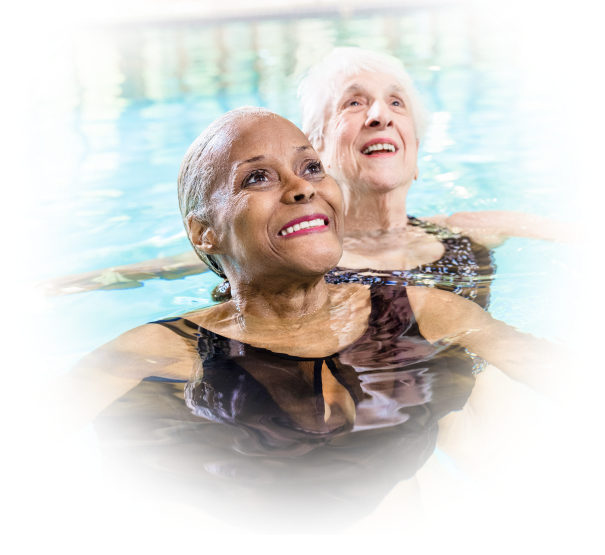 Two senior women in the pool at a HumanGood Life Plan Community