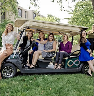 Group of HumanGood team members in a golf cart