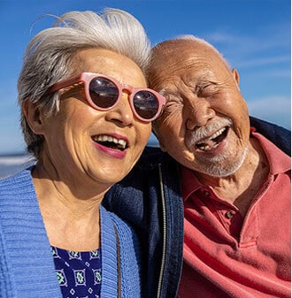Smiling senior couple on the beach