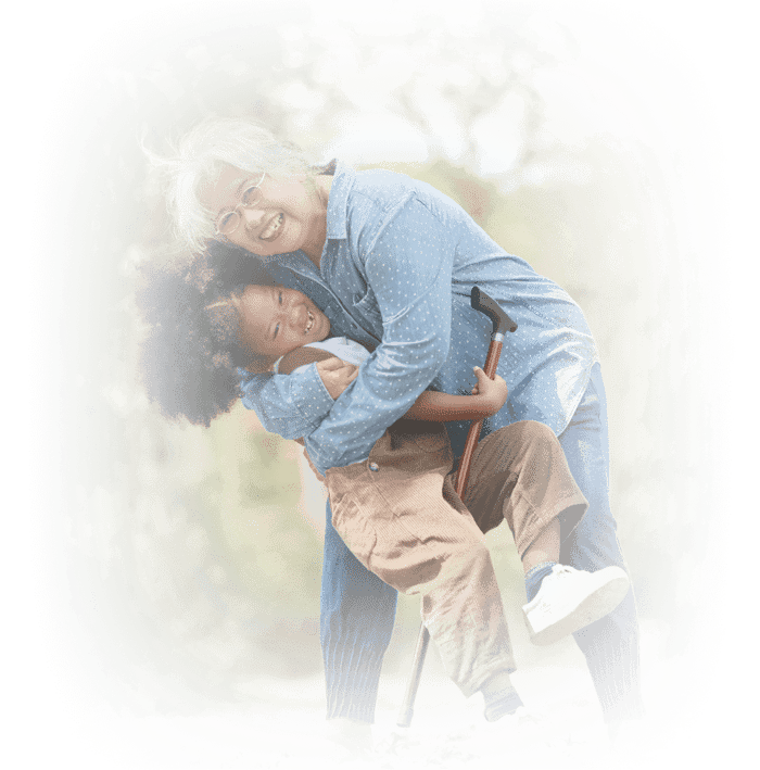 Senior woman hugging her young granddaughter