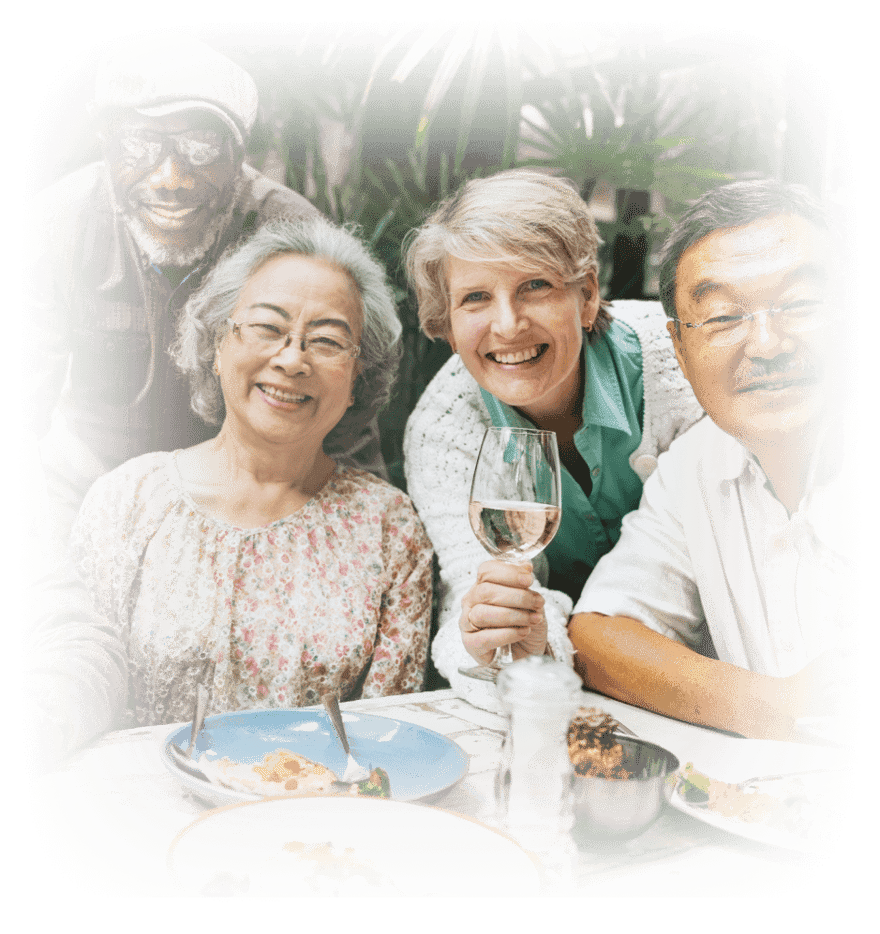 Senior friends having lunch and wine together on outdoor patio